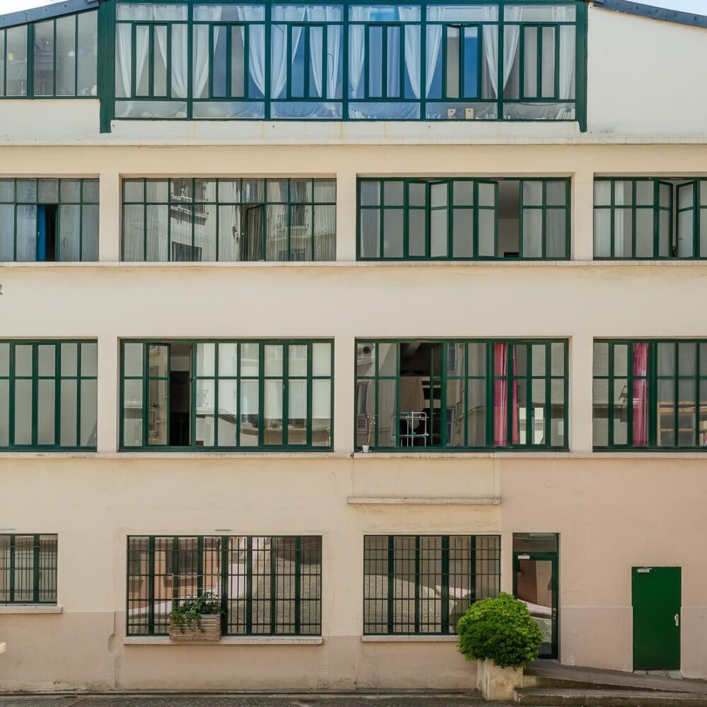 Façade arrière d'anciens ateliers Art Déco réhabilité en appartements et en vente avec l'agence Immobiliere 21juin